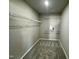 A walk-in closet offers wire racks for ample storage space in the home at 349 Earnest Way # 21, Kenly, NC 27542