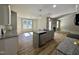 Open kitchen layout with an island, stainless steel appliances, and granite countertops offering seamless flow to living areas at 349 Earnest Way # 21, Kenly, NC 27542