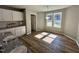 Eat-in kitchen nook with abundant natural light from a large window overlooking the backyard, plus stylish white cabinets at 349 Earnest Way # 21, Kenly, NC 27542