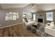 Open-concept living room with a fireplace, wood floors, and stylish decor, creating a cozy and inviting space at 349 Earnest Way # 21, Kenly, NC 27542