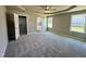 Spacious main bedroom with plush carpet, natural light, and open access to a walk-in closet and the ensuite bathroom at 349 Earnest Way # 21, Kenly, NC 27542