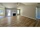 Spacious living room with vaulted ceilings, a ceiling fan, wood flooring, and a cozy fireplace at 349 Earnest Way # 21, Kenly, NC 27542