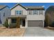 Charming two-story home with gray siding, a two-car garage, and a well-maintained front yard at 3517 Eastern Branch Rd, Raleigh, NC 27610
