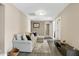 Comfortable living room with plush seating and neutral decor with an exterior door and a large window at 3517 Eastern Branch Rd, Raleigh, NC 27610