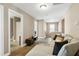 Comfortable living area featuring a sectional sofa, open doorways, and natural light at 3517 Eastern Branch Rd, Raleigh, NC 27610