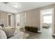 Comfortable living room with plush seating and neutral decor and several open doors at 3517 Eastern Branch Rd, Raleigh, NC 27610