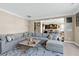 Spacious living room with a large sectional sofa, stylish coffee table, and open access to the kitchen at 3517 Eastern Branch Rd, Raleigh, NC 27610