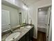 Bathroom with double vanity, granite countertop, and a view of a shower at 377 Earnest Way, Kenly, NC 27542