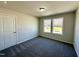 Cozy bedroom with a double window and neutral carpet at 377 Earnest Way, Kenly, NC 27542