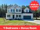 Charming two-story home featuring a well-manicured lawn and an attached two-car garage at 377 Earnest Way, Kenly, NC 27542