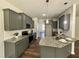 Modern kitchen with granite counters, stainless appliances, and gray cabinets at 377 Earnest Way, Kenly, NC 27542