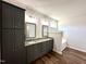 Main bathroom with dual vanity, granite countertops, and a separate tub at 377 Earnest Way, Kenly, NC 27542