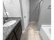 Bathroom with a granite countertop vanity, tile flooring, and shower and tub at 3804 Prince Noah, Wake Forest, NC 27587