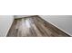 A bedroom with grey walls and dark wood-look flooring at 3804 Prince Noah, Wake Forest, NC 27587