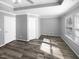 This bedroom offers a tray ceiling and a pair of entry doors, while providing plenty of natural light at 3804 Prince Noah, Wake Forest, NC 27587