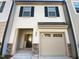 Charming townhome featuring a one car garage and stylish architectural details at 3804 Prince Noah, Wake Forest, NC 27587