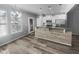 Eat-in kitchen features stainless steel appliances, granite countertops, and a breakfast bar with modern pendant lighting at 3804 Prince Noah, Wake Forest, NC 27587