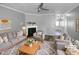 Staged living room showcasing a cozy fireplace and neutral color palette at 3804 Prince Noah, Wake Forest, NC 27587