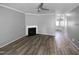 Bright living room featuring a fireplace and ceiling fan at 3804 Prince Noah, Wake Forest, NC 27587