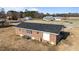 Overhead home view with well-maintained yard, brick exterior, and updated roof and AC, showing outdoor living and comfort at 4459 N Old Carriage Rd, Rocky Mount, NC 27804