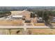 An aerial view that shows proximity to a commercial business, and other homes, while offering seclusion at 4459 N Old Carriage Rd, Rocky Mount, NC 27804