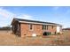 Back of brick home with yard at 4459 N Old Carriage Rd, Rocky Mount, NC 27804