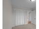Bright bedroom features plush carpeting, closet with paneled doors, and neutral paint at 4459 N Old Carriage Rd, Rocky Mount, NC 27804
