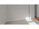 Cozy bedroom filled with natural light and plush carpet, featuring a sliding door closet at 4459 N Old Carriage Rd, Rocky Mount, NC 27804