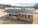 Lovely brick home with covered parking, offering curb appeal and a cozy front porch at 4459 N Old Carriage Rd, Rocky Mount, NC 27804