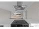 View above cooktop to living room and backyard beyond at 4459 N Old Carriage Rd, Rocky Mount, NC 27804