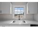 Bright kitchen featuring a stainless sink and quartz countertops at 4459 N Old Carriage Rd, Rocky Mount, NC 27804