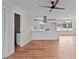 Bright, open kitchen features an island, stainless hood, modern appliances, and hardwood floors at 4459 N Old Carriage Rd, Rocky Mount, NC 27804