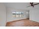 View of bright living room with hardwood floors, large windows, and open space at 4459 N Old Carriage Rd, Rocky Mount, NC 27804