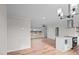 Open-concept living room with hardwood floors, recessed lighting, and a view to the kitchen at 4459 N Old Carriage Rd, Rocky Mount, NC 27804