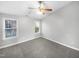 Bright bedroom with two windows and neutral-colored carpet at 4820 Landover Arbor Pl, Raleigh, NC 27616