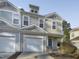 Charming townhome with attached garage, covered front porch, and neutral siding at 4820 Landover Arbor Pl, Raleigh, NC 27616