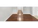 Hallway with hardwood flooring leading to various rooms at 4820 Landover Arbor Pl, Raleigh, NC 27616