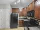 Galley kitchen featuring dark cabinetry and countertops at 4820 Landover Arbor Pl, Raleigh, NC 27616