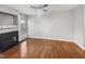 Spacious living room featuring a fireplace, hardwood floors, and plenty of natural light at 4820 Landover Arbor Pl, Raleigh, NC 27616