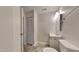 This bathroom is equipped with a sink, toilet, mirror, and closet, offering practicality at 4911 Hollenden Dr, Raleigh, NC 27616