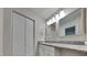 The bathroom offers a double vanity and a closet that creates a spacious and functional area at 4911 Hollenden Dr, Raleigh, NC 27616