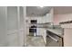 Well-appointed kitchen features sleek stainless steel appliances, granite countertops, and ample storage for culinary enthusiasts at 4911 Hollenden Dr, Raleigh, NC 27616