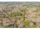 A bird's eye view of the wooded neighborhood showcasing the lush tree coverage and winding roads at 5620 Winthrop Dr, Raleigh, NC 27612