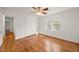 Bright bedroom with hardwood flooring, closet, and a window offering natural light at 5620 Winthrop Dr, Raleigh, NC 27612