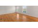Light-filled bedroom with hardwood floors and multiple windows at 5620 Winthrop Dr, Raleigh, NC 27612
