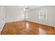 Spacious bedroom with hardwood floors, two windows, and ample closet space at 5620 Winthrop Dr, Raleigh, NC 27612