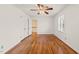 This bedroom features hardwood floors, a closet, and a ceiling fan for added comfort at 5620 Winthrop Dr, Raleigh, NC 27612