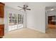 Bright dining area with sliding glass doors leading to an outdoor deck and a ceiling fan at 5620 Winthrop Dr, Raleigh, NC 27612