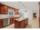 Kitchen island with granite countertops, stainless appliances, and custom wood cabinetry at 5620 Winthrop Dr, Raleigh, NC 27612