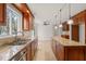 Kitchen with a large window, stainless steel appliances, and granite countertops at 5620 Winthrop Dr, Raleigh, NC 27612